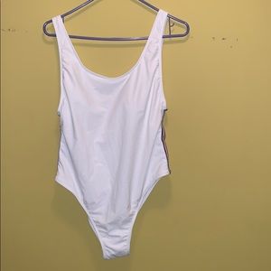 White swimming suit with red, white & blue strips